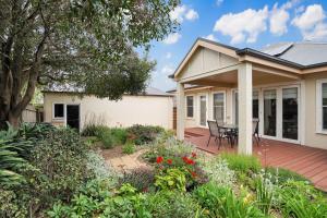 a house with a patio and a table and chairs at Merri Place in Warrnambool
