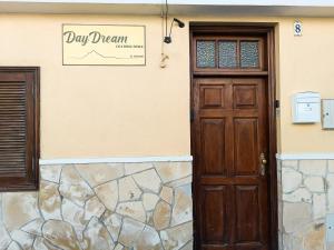 a door to a day dream sign on a building at Daydream Medano Coliving in El Médano
