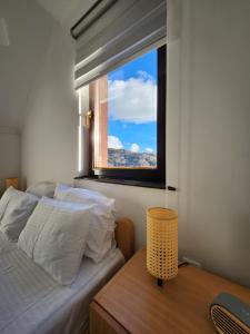 a bedroom with a bed and a window at Detelina in Kopaonik +12 photos