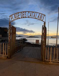 a gate to a dock with a sign that reads page des calais at T2 vue mer CATALANS - NETFLIX - VELODROME in Marseille