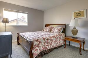 a bedroom with a bed and a window at Pet-Friendly Citrus Heights Home Fenced Backyard! in Citrus Heights