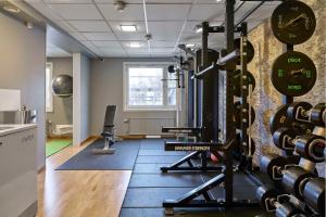 a room with a gym with dumbbells on the wall at Scandic Umeå Syd in Umeå