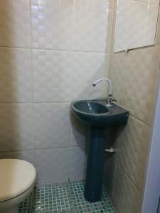 a bathroom with a sink and a toilet at SOL in Búzios
