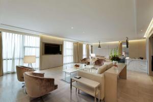 a living room with a couch and a table at Hilton Xi'an High-tech Zone in Xi'an