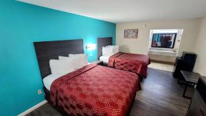 Ένα ή περισσότερα κρεβάτια σε δωμάτιο στο Econo Lodge Kosciusko +15 φωτογραφίες