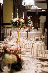 a long table with white tables with candles and flowers at Radisson Blu St. Helen's Hotel in Stillorgan