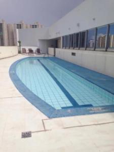a large swimming pool in a large building at 512. Flat hotel Go Inn in Brasilia