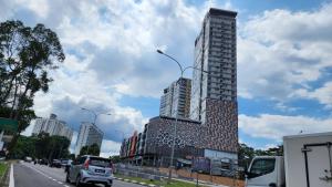 a tall building on the side of a city street at Luxury Duplex Suite 4 pax Netflix Wifi Selayang KL in Batu Caves