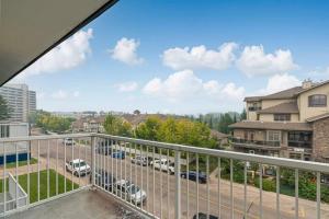 a balcony with a view of a parking lot at COZY 1BR Top Floor with Balcony Newly Renovated in Fort McMurray