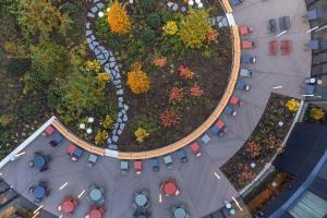 an overhead view of a garden with tables and chairs at STAGES HOTEL Prague, a Tribute Portfolio Hotel in Prague