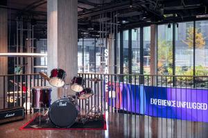 a drum set on a stage in a building at STAGES HOTEL Prague, a Tribute Portfolio Hotel in Prague