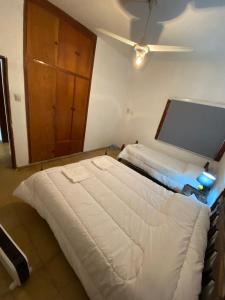 En eller flere senger på et rom på Hostal San Antonio