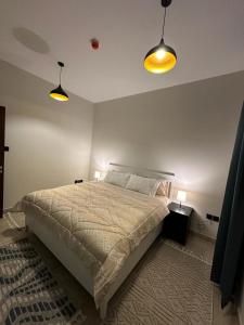 Ліжко або ліжка в номері Sharja 1101