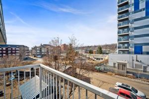 an apartment balcony with a view of a parking lot at Spacious 2BR Top Floor with Balcony Free WiFi in Fort McMurray