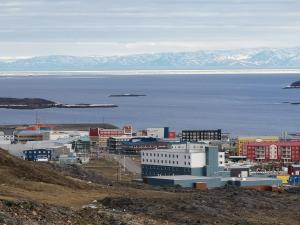 an aerial view of a city and the ocean at Grant Arctic Escape in Iqaluit
