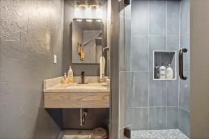 a bathroom with a sink and a shower at Elegant Comfort House -modern Amenities- 40-1 in Oklahoma City