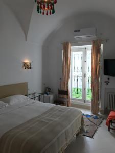 Postel nebo postele na pokoji v ubytování Dar Esma
