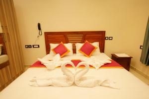 Postel nebo postele na pokoji v ubytování Grand Residency & Resort