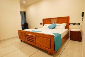 Postel nebo postele na pokoji v ubytování Grand Residency & Resort