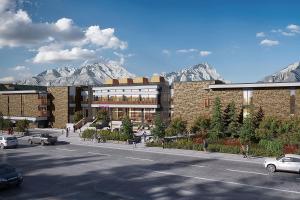 a rendering of a building with mountains in the background at Moxy Banff in Banff