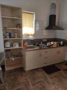 a kitchen with a sink and a counter top at Muktamma in Tiruvannāmalai