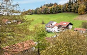 an aerial view of a house on a green field at Ferienhaus Bergblick in Gschwend