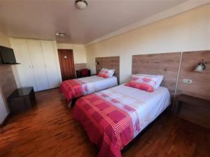 Postel nebo postele na pokoji v ubytování Hotel Rincon Aleman