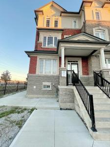 a house with a staircase in front of it at DIAMOND PLACE in Brampton