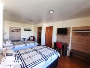 Postel nebo postele na pokoji v ubytování Hotel Rincon Aleman