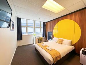 Postel nebo postele na pokoji v ubytování Wellington Hotel