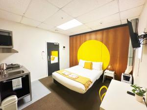 Postel nebo postele na pokoji v ubytování Wellington Hotel