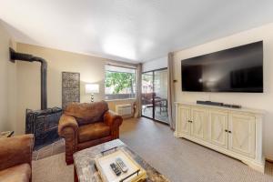 a living room with a large flat screen tv at Lakeland Village South Lake Tahoe in South Lake Tahoe +21 photos