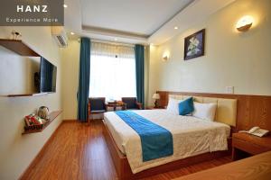 a hotel room with a bed and a window at S79 Noi Bai Airport Hotel in Hanoi
