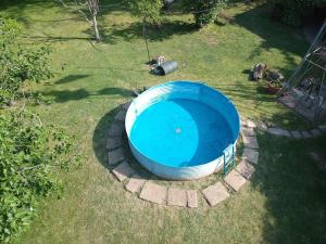 an overhead view of a blue pool in the grass at La Carmencita casa de campo, Manzanares, Pilar in Pilar
