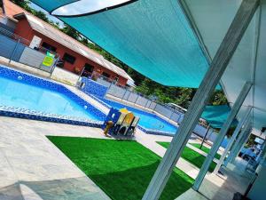 an overhead view of a swimming pool in a building at Green Forest Resort in Setiu