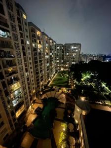 a view of a city at night with tall buildings at Vista Vibes in Chennai