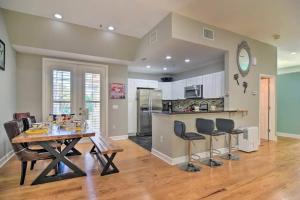 a kitchen and living room with a table and chairs at Coastal Sea Side Townhome in Clearwater Beach