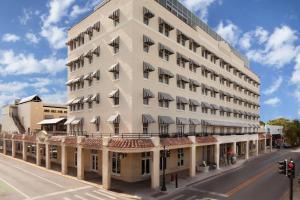 a large white building on a street with a road at La Concha Key West in Key West