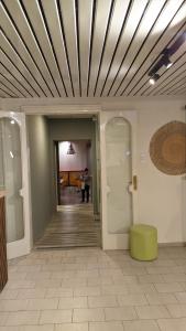 a hallway of a building with a coffered ceiling at Hotel Turis in San Rafael