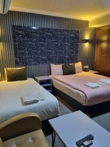 Postel nebo postele na pokoji v ubytování koza millenyum hotel&spa + 37 fotografií