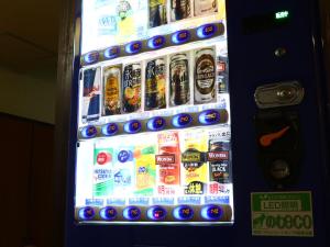a vending machine filled with lots of soda and drinks at Shinseto Station Hotel in Seto