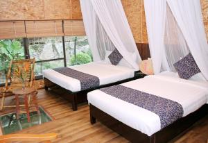 Ein Bett oder Betten in einem Zimmer der Unterkunft Tam Coc Lion Kings Hotel & Resort