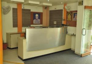 a room with a large counter in a building at Hotel Premier - Hotel in Saket Society Bhusawal in Bhusāwal