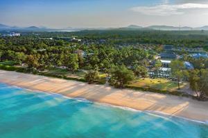 an aerial view of a beach and the ocean at JW Marriott Phuket Resort and Spa in Mai Khao Beach