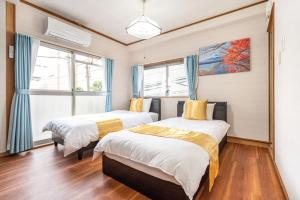 Postel nebo postele na pokoji v ubytování KYARA Hotel 白鳥