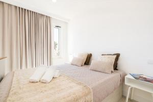 Llit o llits en una habitació de White Studio - Ocean View