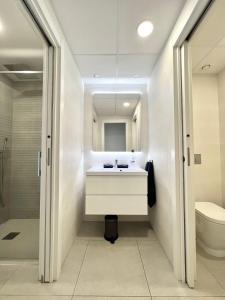 a bathroom with a sink and a toilet at Flamenca Village apartment - close to the beach and La Zenia Boulevard in Orihuela