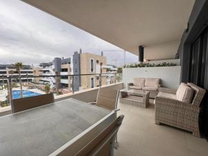 an apartment balcony with a view of a pool at Flamenca Village apartment - close to the beach and La Zenia Boulevard in Orihuela