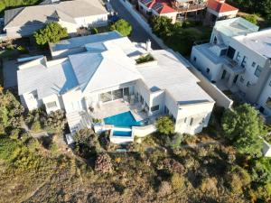 an aerial view of a white house with a swimming pool at The Boulders Langebaan in Langebaan