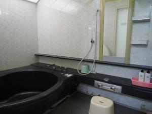 Koupelna v ubytování Capsule Hotel Block Room